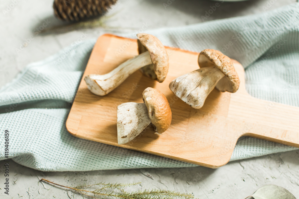 fresh white mushrooms on wooden board