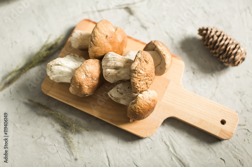 fresh white mushrooms on wooden board