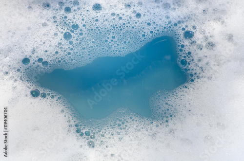 Papier peint white foam on blue water