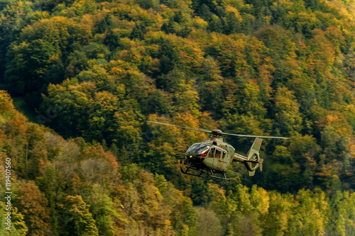 AXALP, SWITZERLAND - OCTOBER 11: Swiss Airforce Eurocopter 635P2+ during training before Axalp Swiss Air Force Live Firing Demo on October 11, 2011 in Axalp, Switzerland