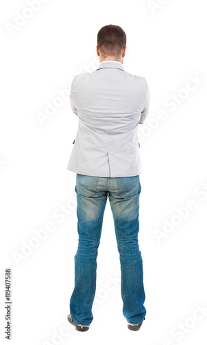 back view of Business man looks. Rear view people collection. backside view of person. Isolated over white background. A guy in a white jacket folded his arms across his chest.