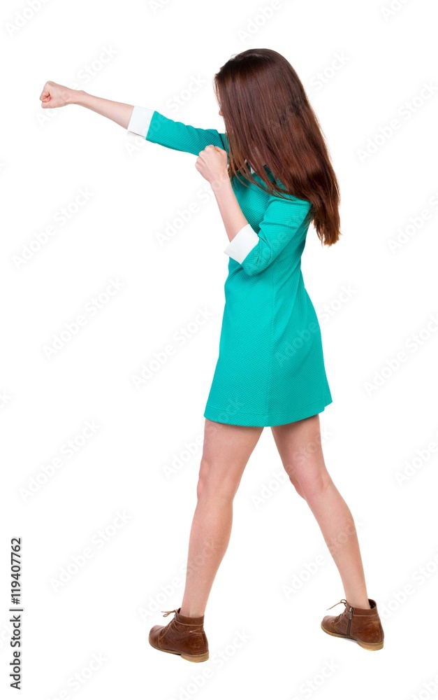 skinny woman funny fights waving his arms and legs. Rear view people collection. backside view of person. Isolated over white background. Girl in aqua dress beats hand. skinny woman funny fights waving his arms and legs. Rear view people collection. backside view of person. Isolated over white background. Girl in aqua dress beats hand.