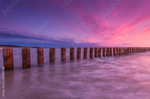 Fototapeta Naklejka Na Ścianę i Meble -  Wooden breakwater - Baltic seascape at sunset, Poland