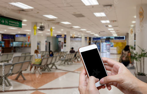 Human holding blank screen of smart phone and waiting arrivals t