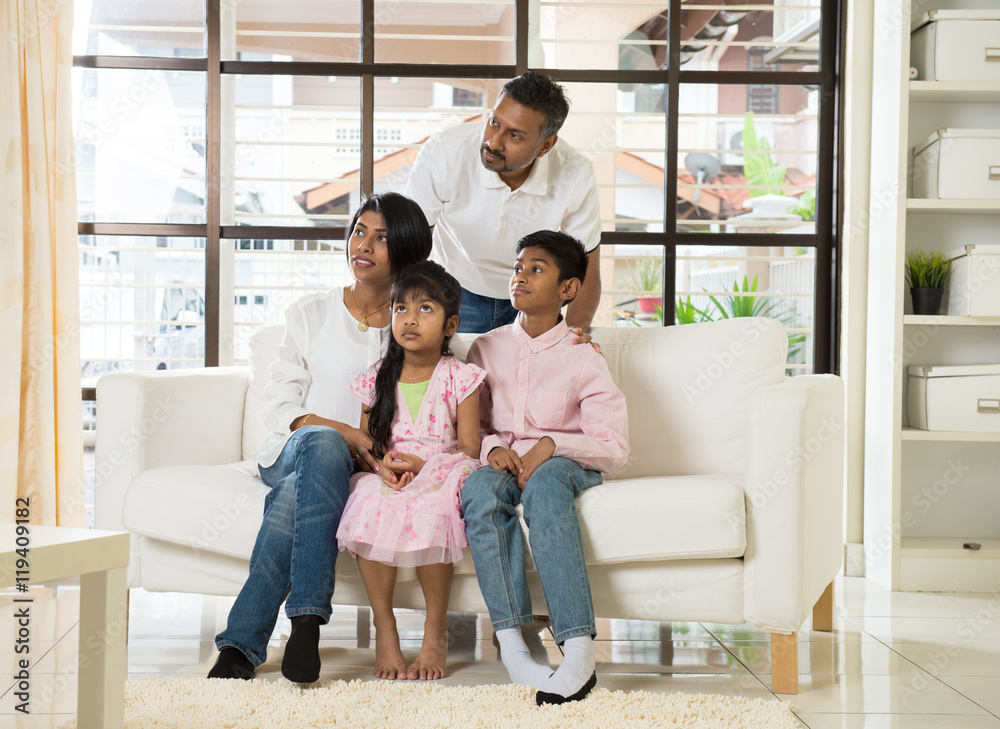 happy indian family at living room happy indian family at living room