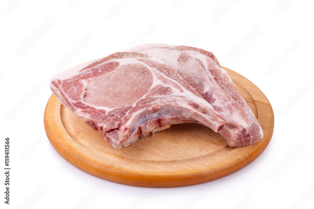 Raw pork chop on wooden broad or cooking pork chop steak Raw pork chop on wooden broad or cooking pork chop steak