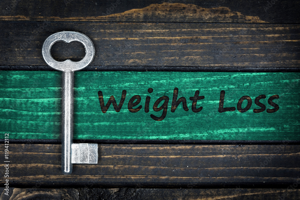 Obraz premium Weight Loss word and old key