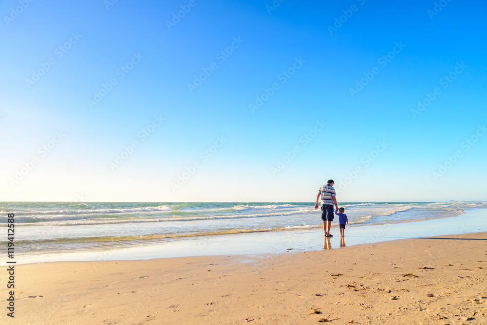 Father and Son Walking Together Holding Hands