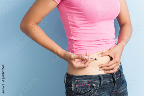 woman use a blood glucose meter