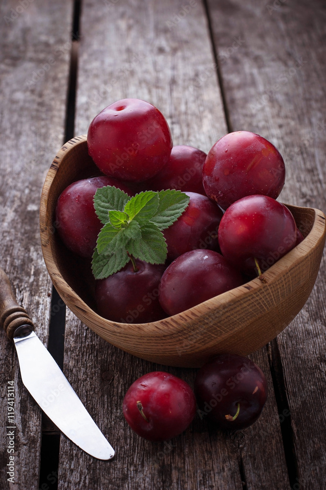 Sweet plums on wooden background Sweet plums on wooden background