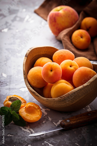 Sweet apricots on wooden background
