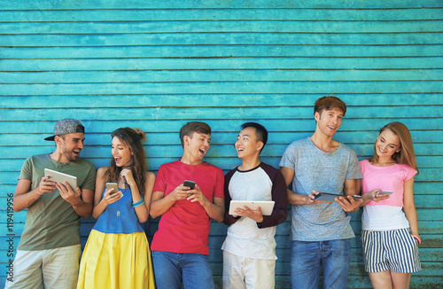 Young people with gadgets o...