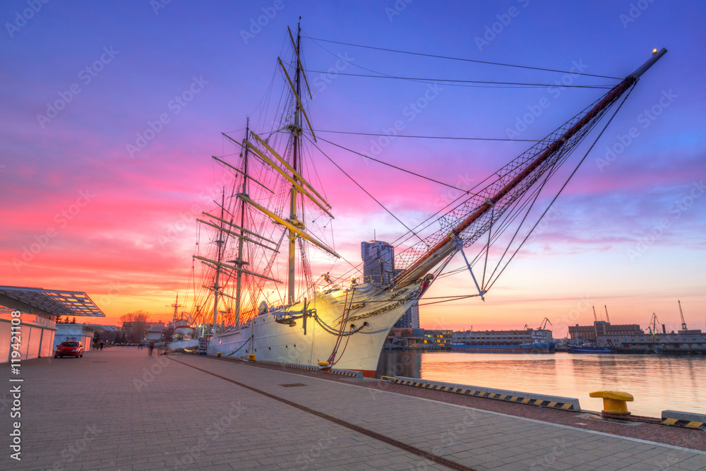 Fototapeta premium Sailboat in Gdynia harbour at sunset, Poland