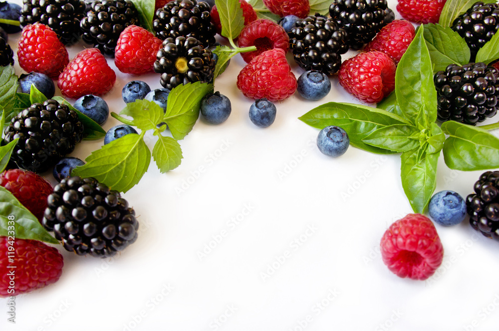 Various fresh summer berries. Ripe blueberries, raspberries and blackberries. Berries on white background. Top view with copy space. Various fresh summer berries. Ripe blueberries, raspberries and blackberries. Berries on white background. Top view with copy space.