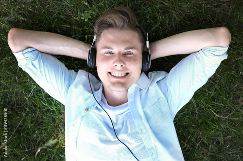 Handsome man listening musi...