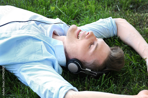 Handsome man listening musi...