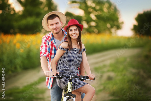 Young couple on bicycle in ...