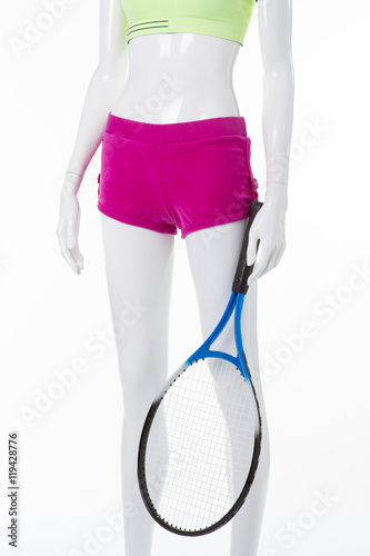 Bright top and shorts with tennis racket. © margostock