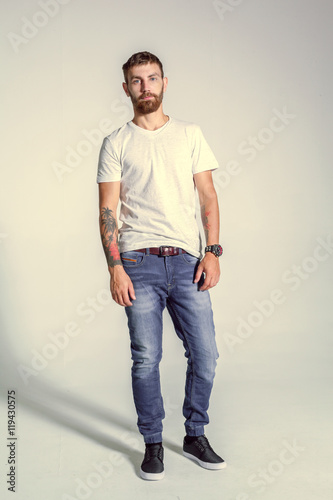 full length picture of a casual young man posing
