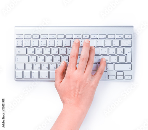 Typing femle hand on keyboard isolated over white