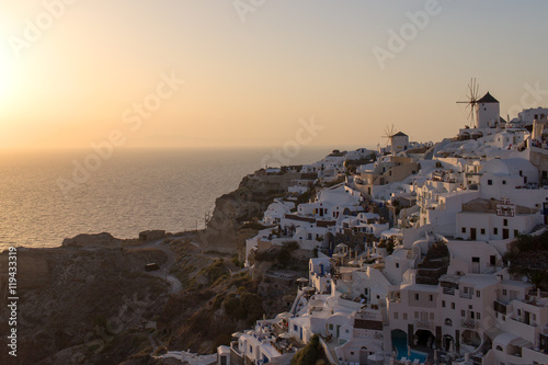 Santorini Island - view of the famous windmills at sunset