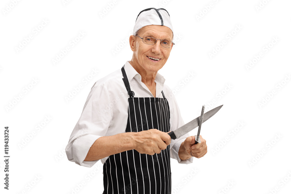 Elderly butcher sharpening his knife Elderly butcher sharpening his knife