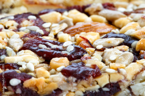 Detail of fruit, nut and seed bar with cranberries.