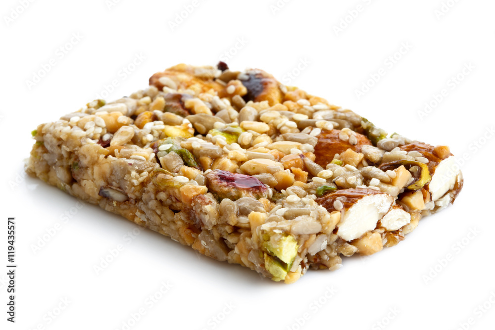 Fruit, nut and seed bar with pistachios isolated on white. Fruit, nut and seed bar with pistachios isolated on white.