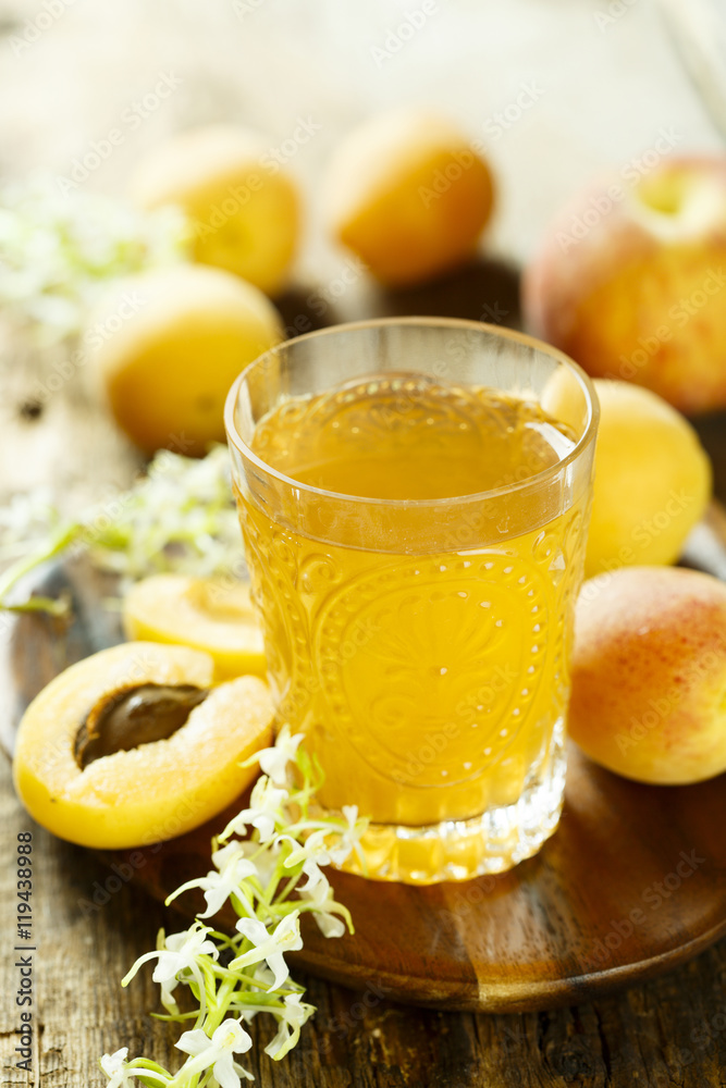 Fototapeta premium Glass of peach and apricot drink