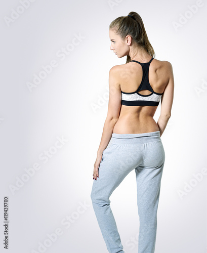 Young woman posing in sport clothes