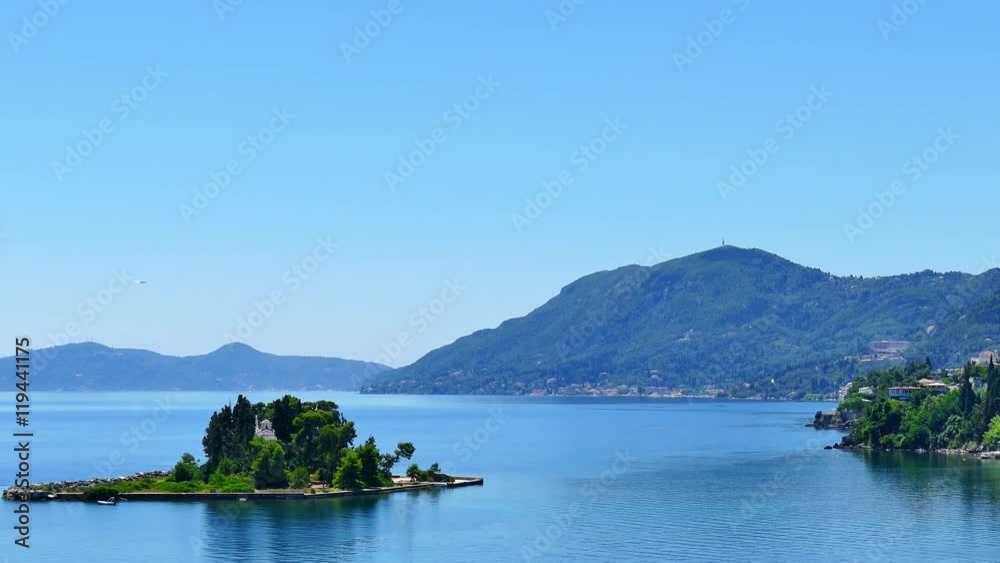Islands Pontikonisi islet hills in ocean sea water 4k travel video nature background. Tropical forest and blue sky