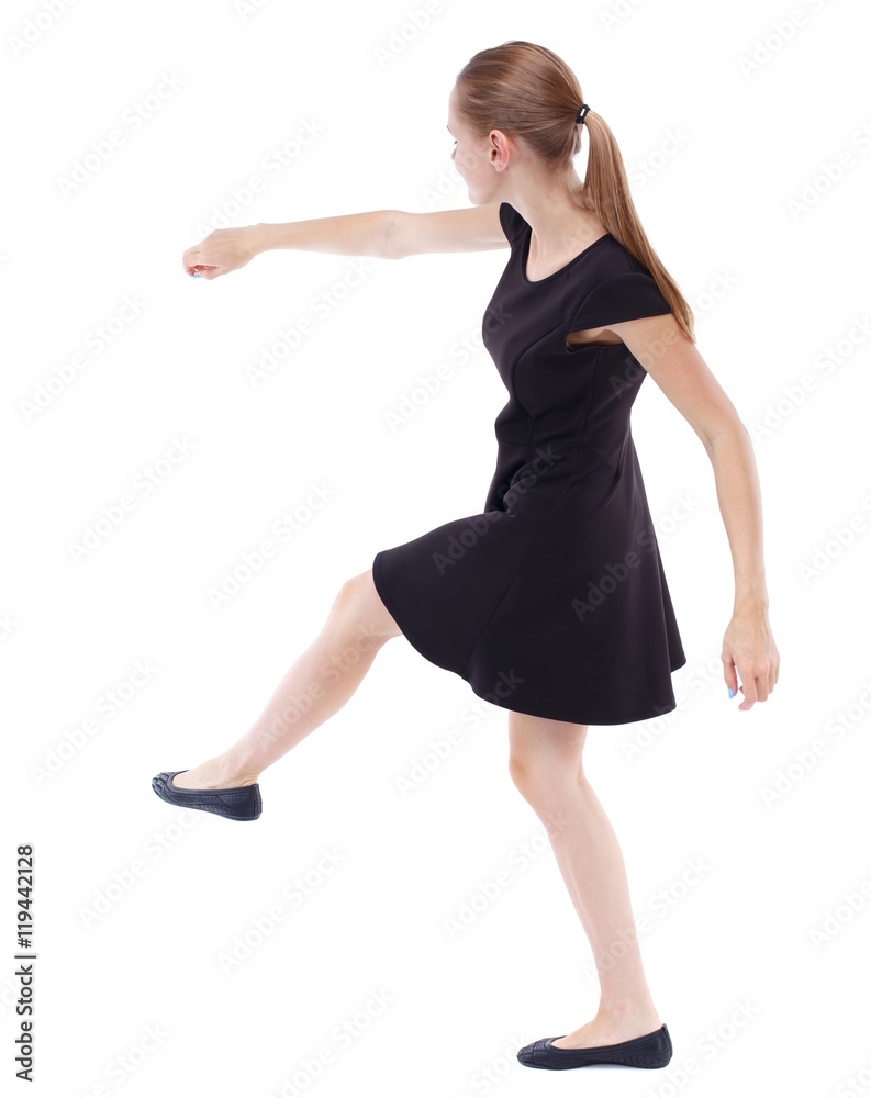 skinny woman funny fights waving his arms and legs. Blonde in a short black dress kicking ball skinny woman funny fights waving his arms and legs. Blonde in a short black dress kicking ball