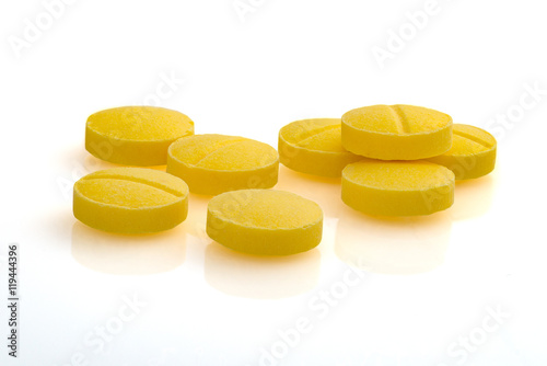 Yellow medicine close up macro photography drug on white background