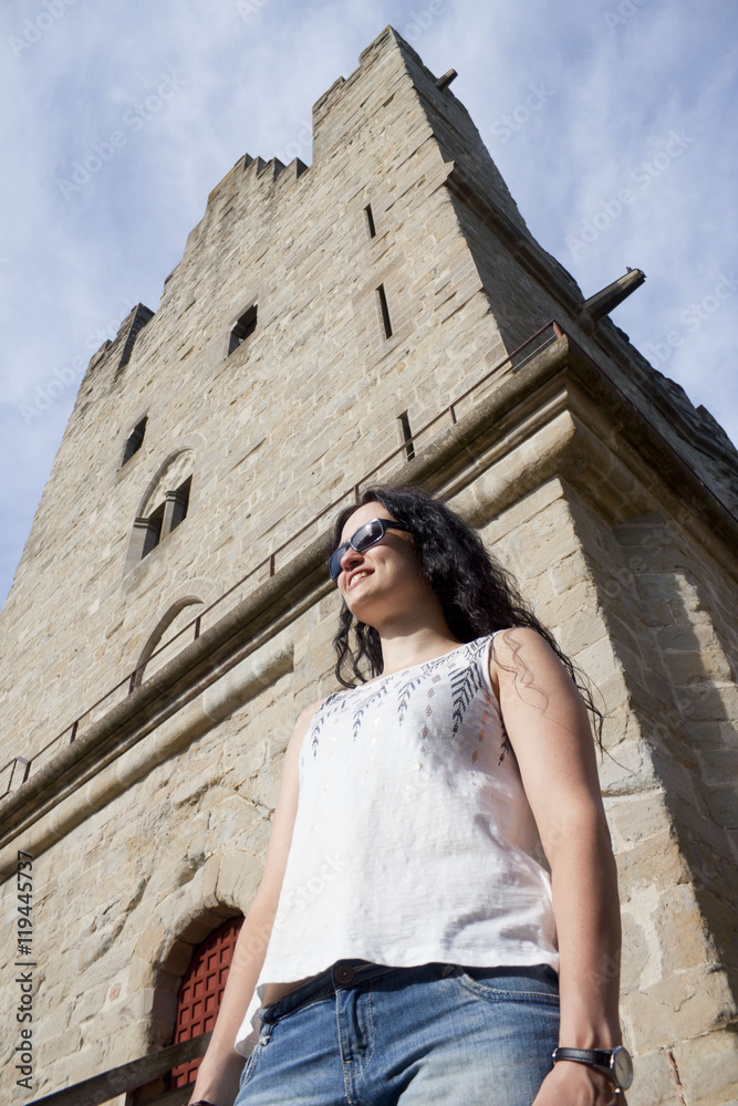 tourist girl in front of a tower in Carcassonne city