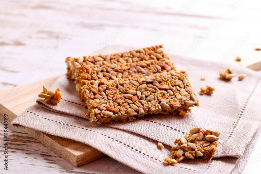 Healthy granola bar on wooden background