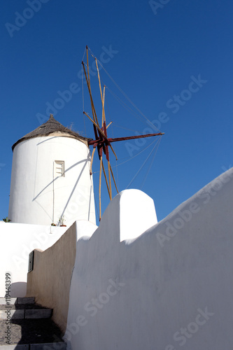 Windmill of Oia town at sunny day, Santorini