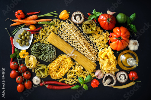 Italian food ingredients on slate background