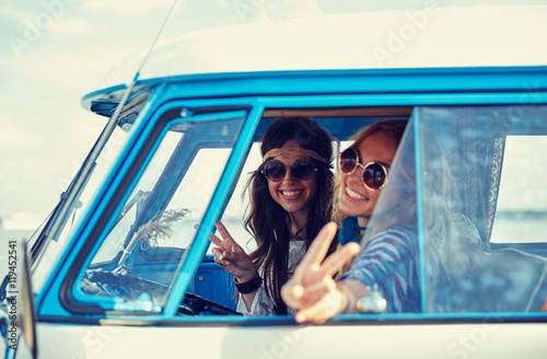 smiling young hippie women driving minivan car © Syda Productions