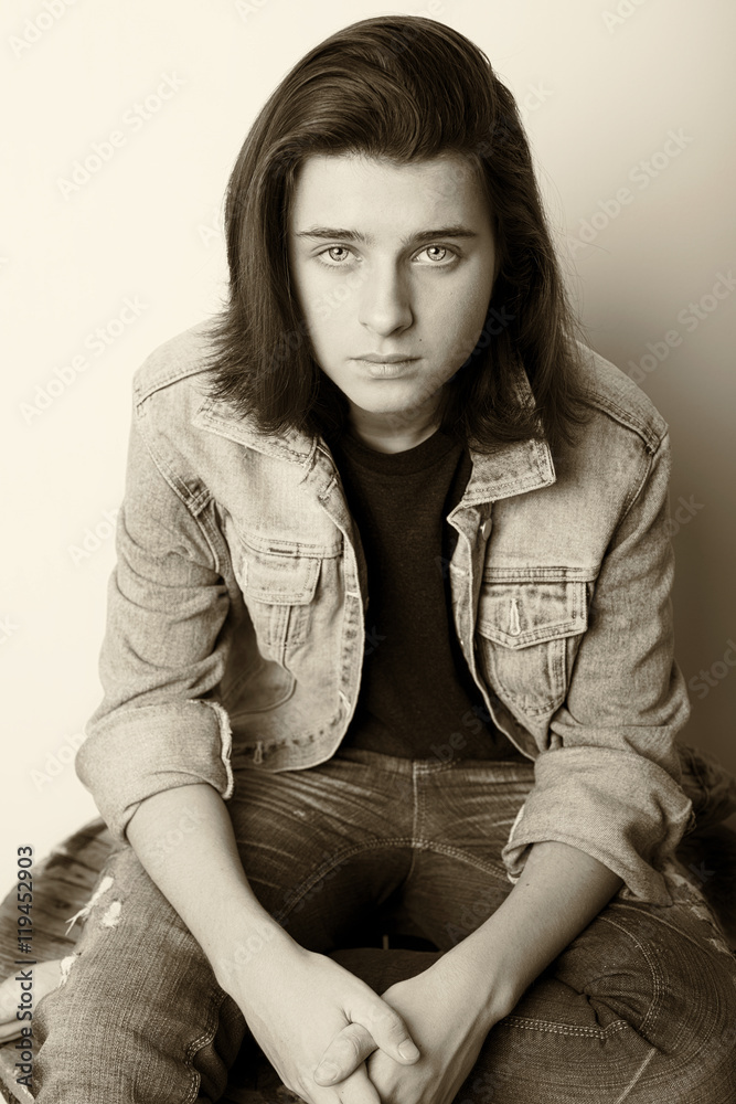 Fashion portrait of a teenager wearing jeans jacket.Vintage style