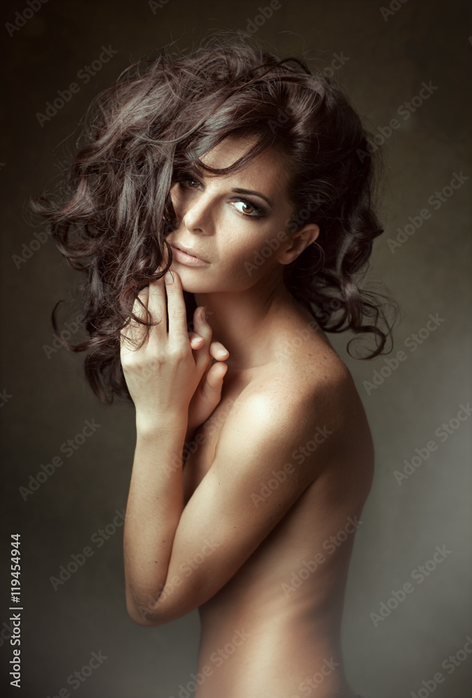 Fototapeta premium Long curly Hair. Sensual woman Portrait.