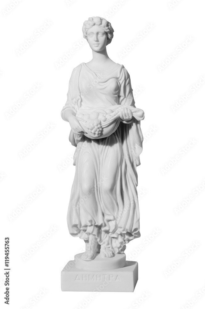 Antique sculpture of the almost naked woman with fruits on a whi