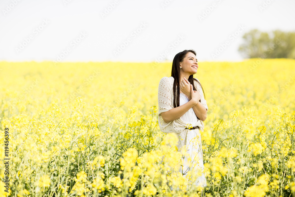 Young woman in the spring field Young woman in the spring field