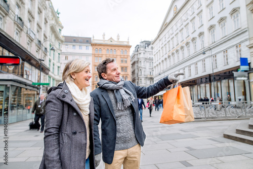 Senior couple shopping in centre of the city. Winter