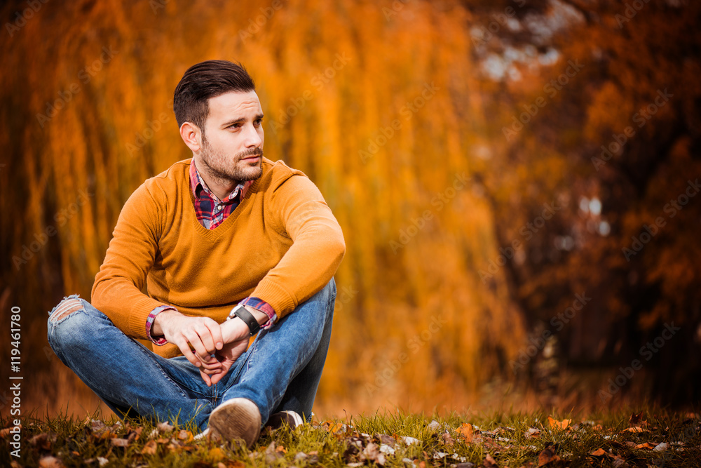 Man posing in autumn park Man posing in autumn park