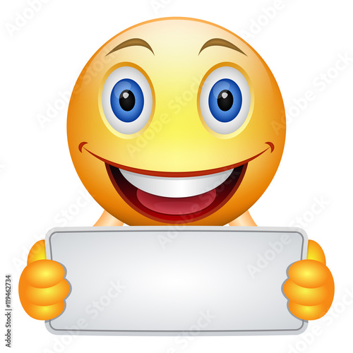 Cartoon emoticon keeps a banner or frame. Yellow smiley keeps a signboard or placard for inscription. Place for lettering or advertising. Your text here. Vector isolated object.