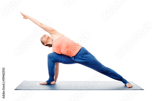 Woman doing Ashtanga Vinyasa Yoga asana Utthita parsvakonasana photo