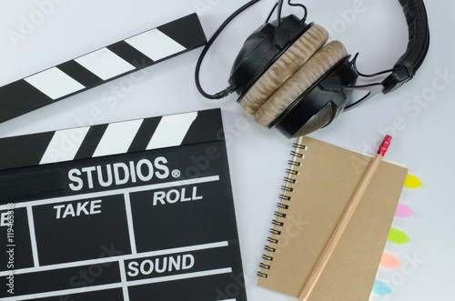 Slate film and notebook headphone white background