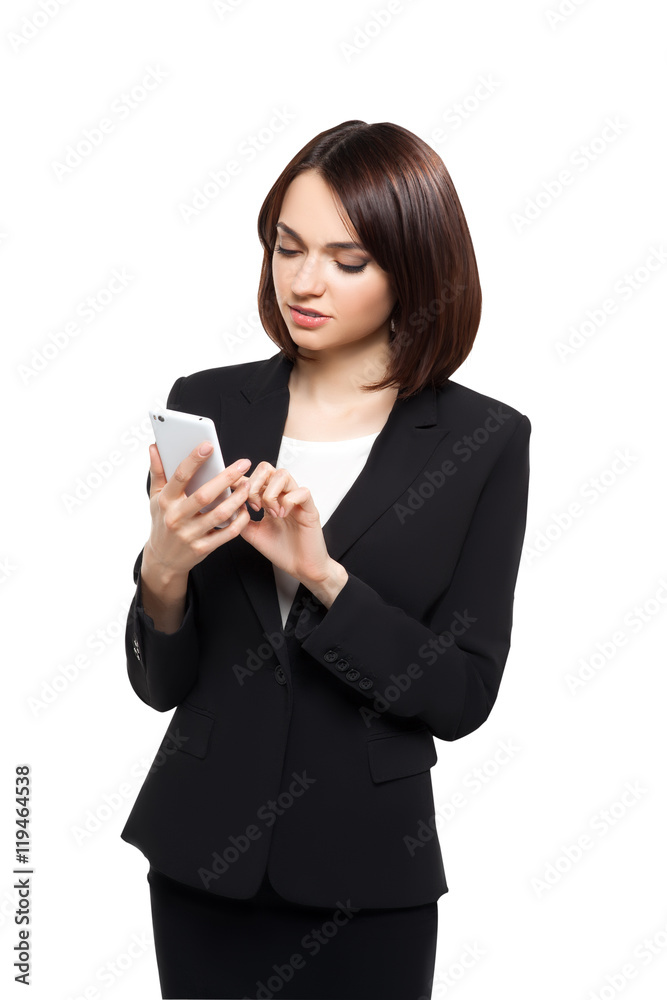 Beautiful business woman typing on her smartphone Beautiful business woman typing on her smartphone