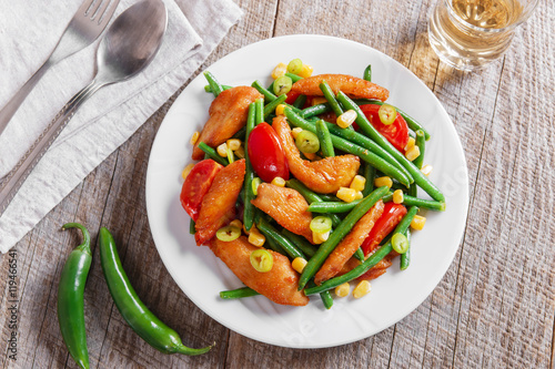 chicken meat with green beans and tomato corn