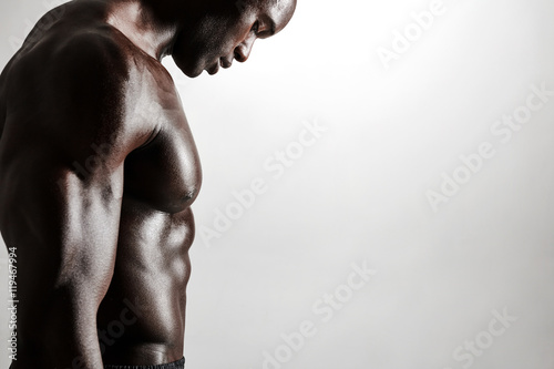 Canvas Print Muscular young man standing shirtless